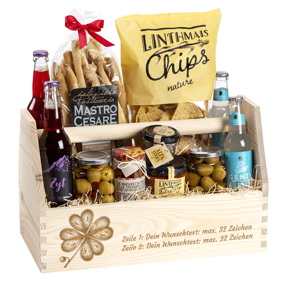 Geschenkkorb gefüllt mit tollen Apero Produkten. Graviert mit dem Sujet Kleeblatt. 